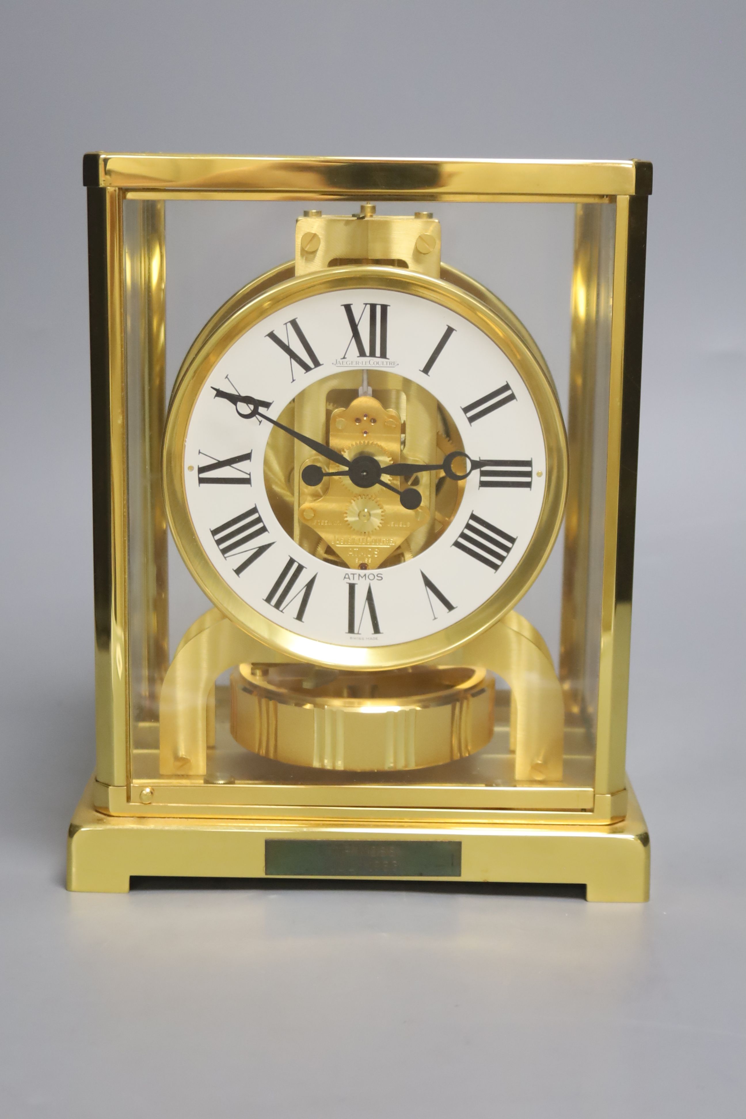 A Jaeger le Coultre Atmos mantel clock, with white enamelled Roman chapter ring, in gilt-brass panelled case, height 22.5cm